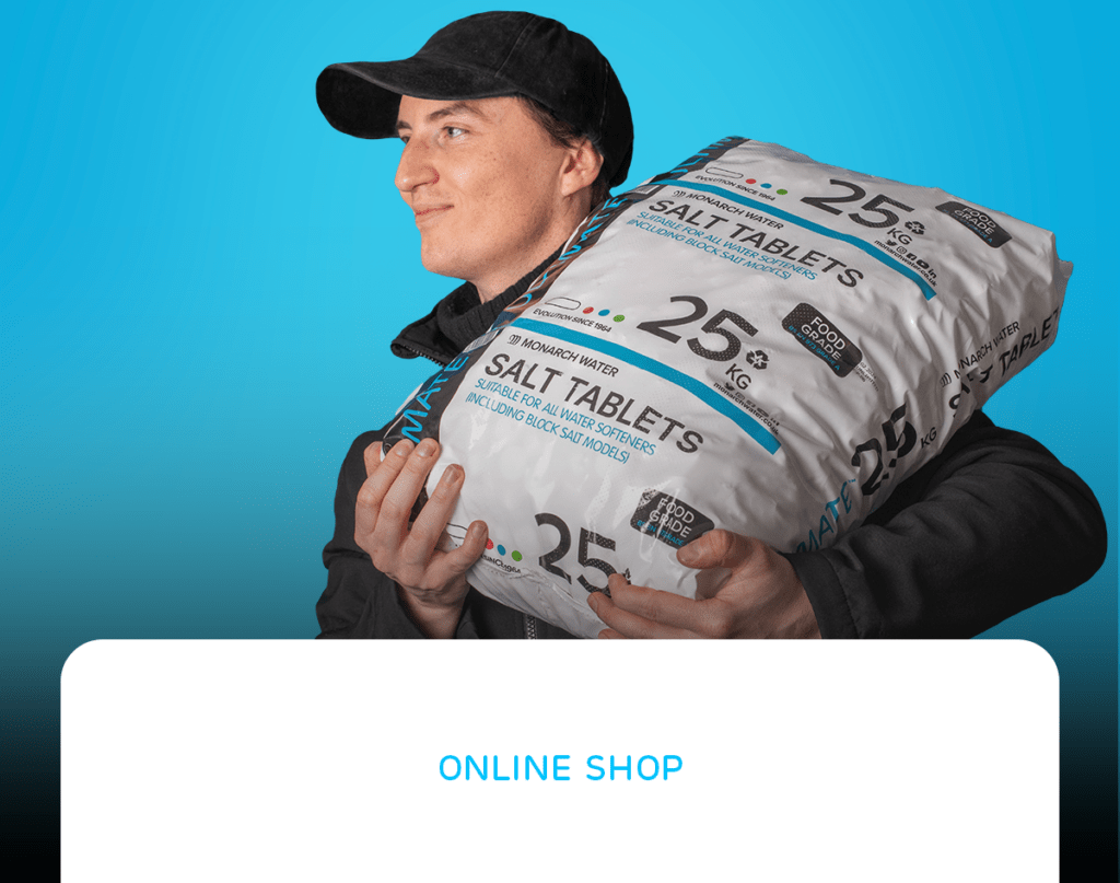 Online shop image, Monarch Water employee carrying a bag of water softener salt